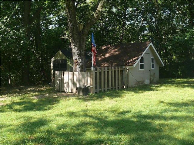 view of yard with an outdoor structure and central air condition unit