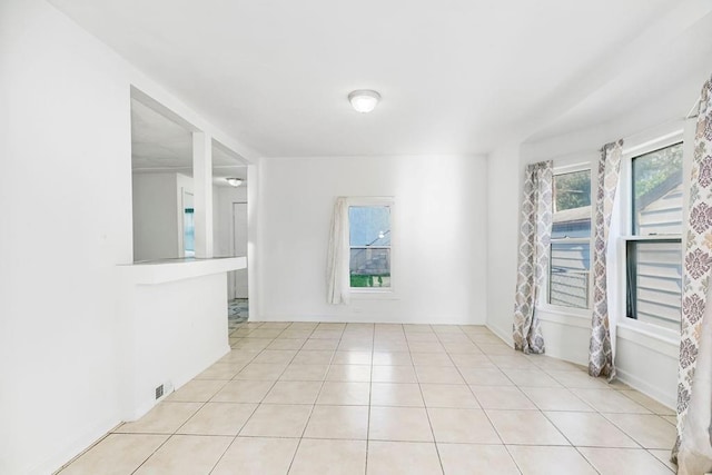 empty room with light tile patterned floors