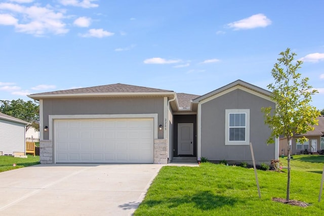 ranch-style house with a garage and a front lawn