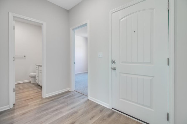 foyer entrance with light hardwood / wood-style floors