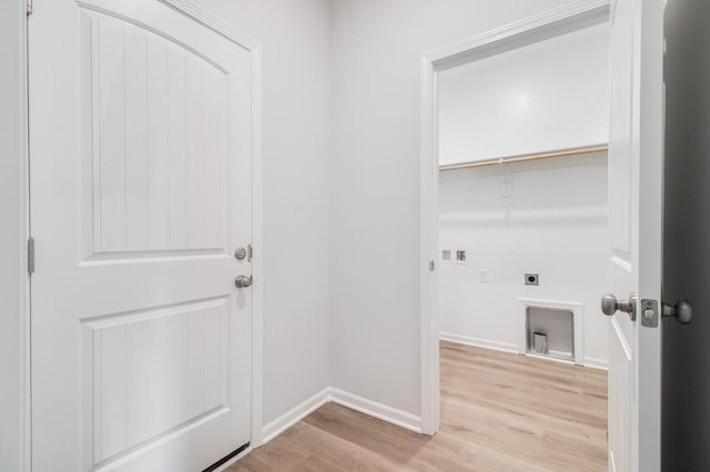 laundry room with washer hookup, hookup for an electric dryer, and light wood-type flooring