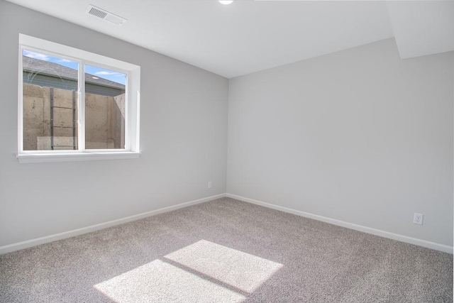 unfurnished room featuring carpet floors