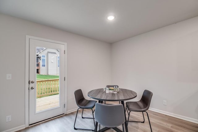 dining area with light hardwood / wood-style flooring