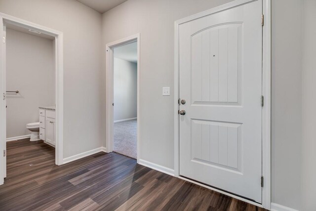 hallway with dark carpet