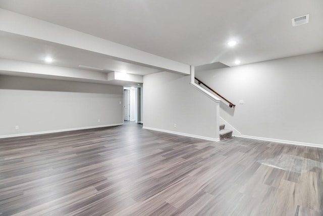 basement with hardwood / wood-style flooring