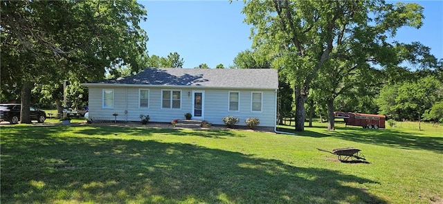 back of house with a lawn