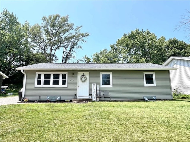 ranch-style house featuring a front lawn