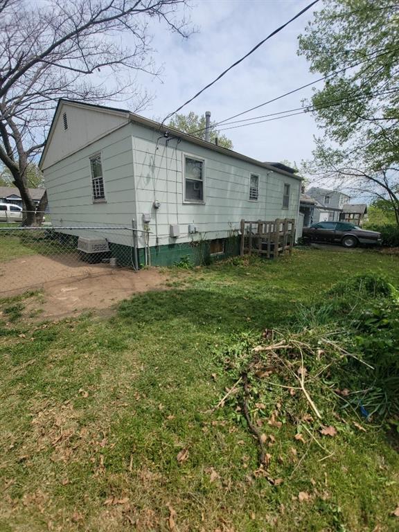 view of home's exterior featuring a yard