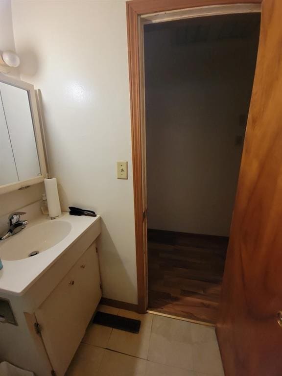 bathroom with tile patterned flooring and vanity