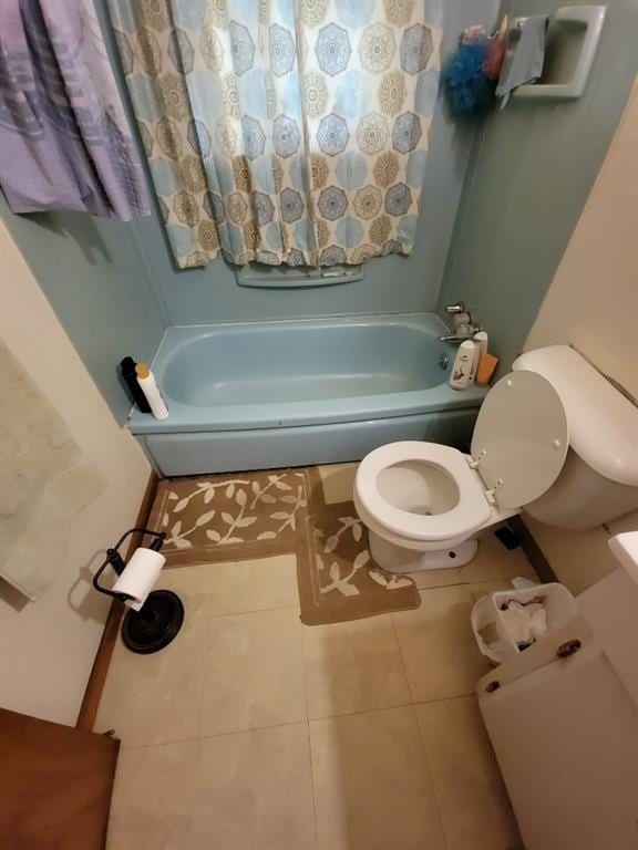 bathroom featuring tile patterned flooring and toilet