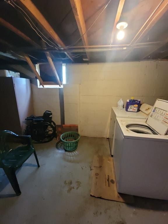 basement with washer and dryer and refrigerator