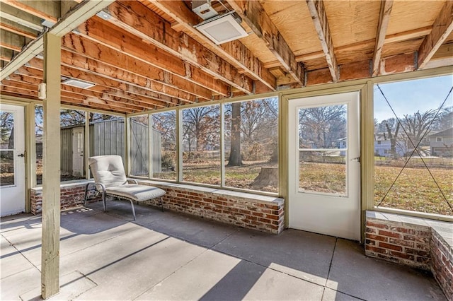 unfurnished sunroom with a wealth of natural light