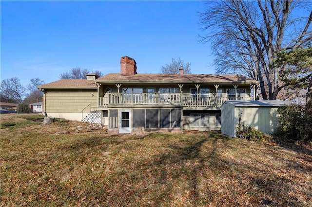 rear view of house with a lawn