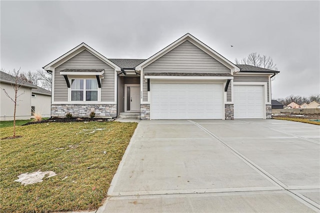 view of front facade with a garage and a front lawn