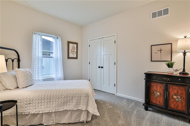 carpeted bedroom featuring a closet