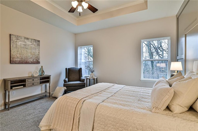 bedroom with carpet floors, multiple windows, and ceiling fan