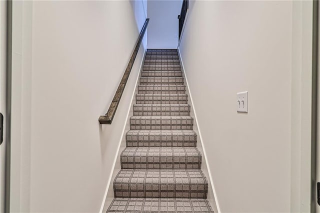 staircase with tile patterned floors