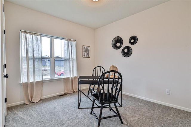 interior space with a healthy amount of sunlight and light colored carpet