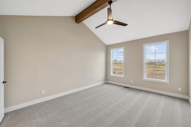 carpeted empty room featuring vaulted ceiling with beams and ceiling fan