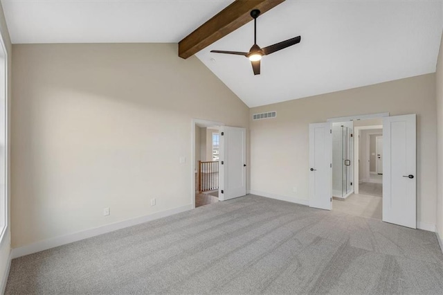 unfurnished bedroom featuring ceiling fan, beamed ceiling, light colored carpet, and high vaulted ceiling