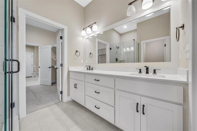 bathroom featuring vanity and a shower with shower door