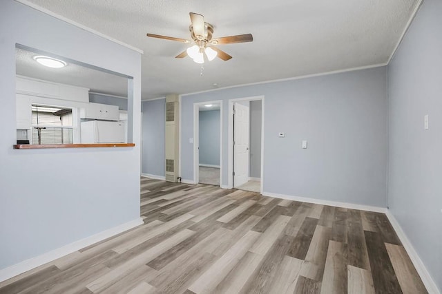 unfurnished living room featuring crown molding, ceiling fan, light hardwood / wood-style floors, and a textured ceiling