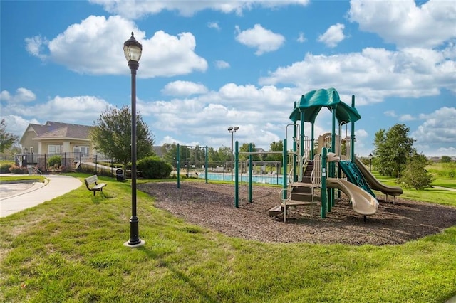 view of playground with a yard