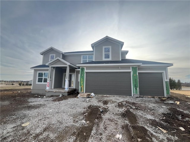 view of front of property featuring a garage