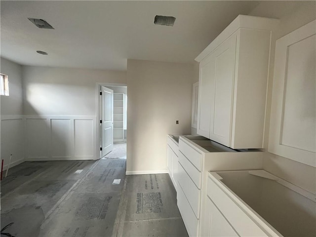 laundry room with hardwood / wood-style floors