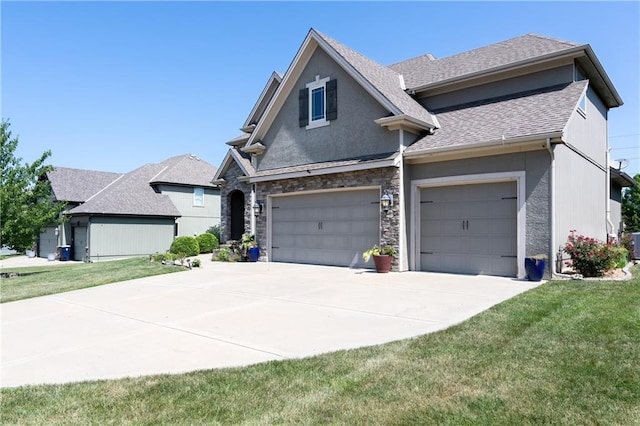 9614 NE 97th St, Kansas City, MO 64157 - traditional-style home featuring stucco siding, roof with shingles, a front yard, stone siding, and driveway