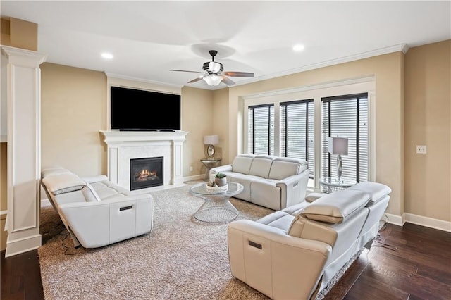 living room with ceiling fan, crown molding, and dark hardwood / wood-style flooring