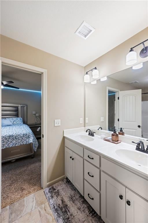 bathroom featuring ceiling fan and vanity