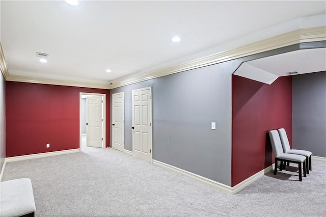 unfurnished room featuring light carpet and ornamental molding