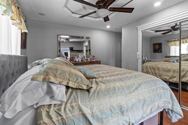 bedroom featuring a ceiling fan, wood finished floors, and recessed lighting