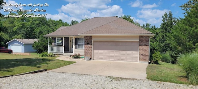 ranch-style home featuring a garage, a front yard, and a porch