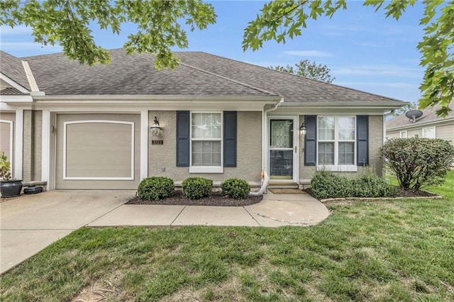 single story home with a garage and a front lawn