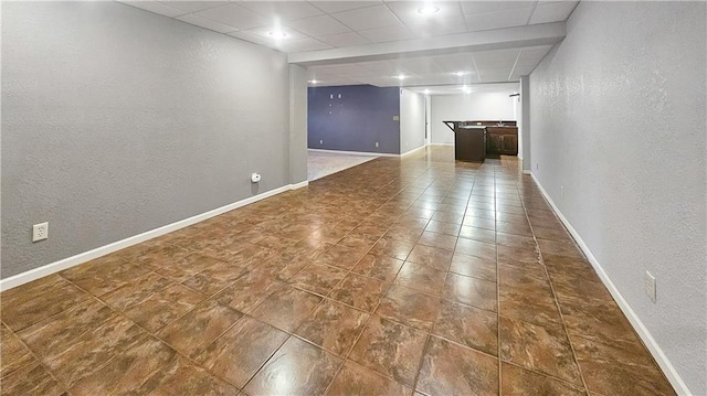 basement featuring tile patterned flooring