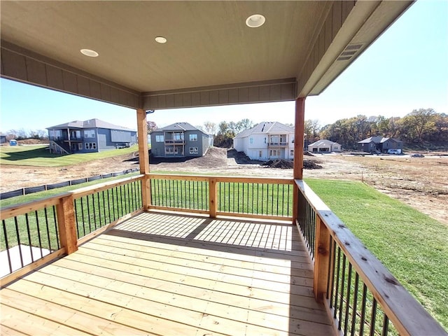 wooden deck with a yard