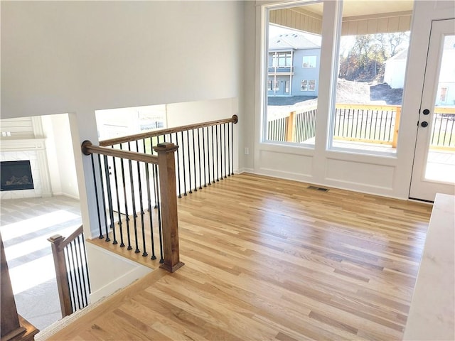 interior space featuring hardwood / wood-style floors and a tile fireplace