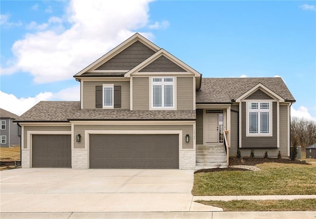 view of front of home featuring a garage and a front yard