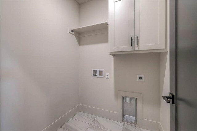 washroom featuring cabinets, hookup for an electric dryer, and hookup for a washing machine