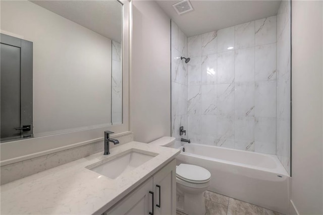 full bathroom featuring vanity, toilet, and tiled shower / bath