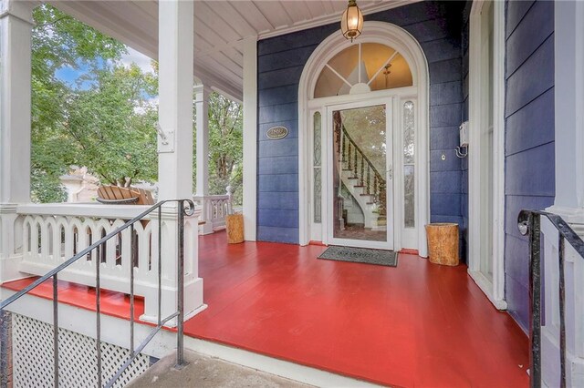 view of exterior entry with covered porch