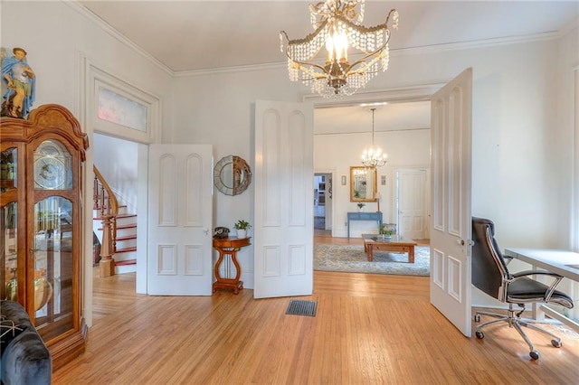 office area with crown molding, light wood-style floors, a chandelier, and visible vents