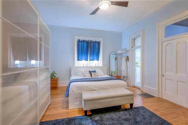 bedroom featuring ceiling fan and wood finished floors
