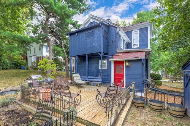 rear view of property with a deck