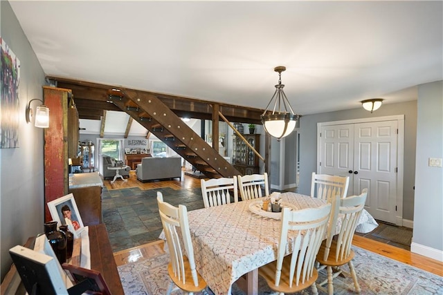 dining area with hardwood / wood-style flooring