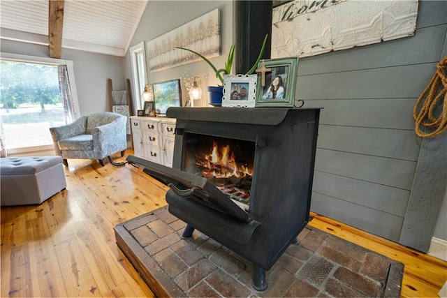 interior space with beamed ceiling and hardwood / wood-style floors