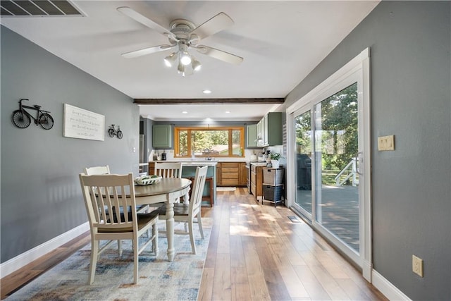 dining space featuring ceiling fan and light hardwood / wood-style flooring