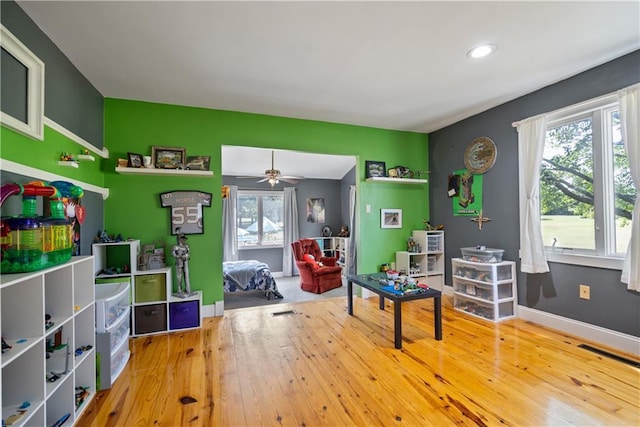 rec room featuring ceiling fan and wood-type flooring